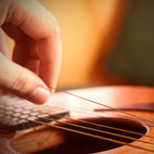 How To Change A 6 String Acoustic Guitar's Strings